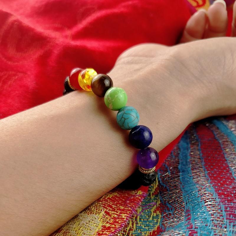 7 Chakra Lava Stone Bracelet on the hand