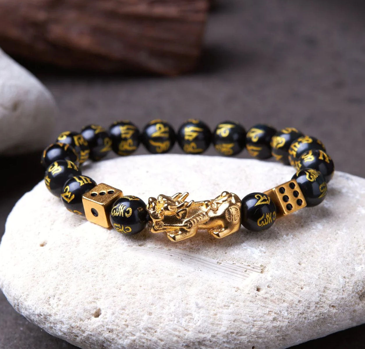 Dice Pixiu Wealth Bracelet on the rock