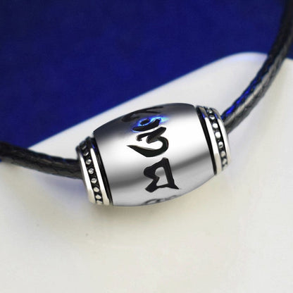 tibetan mantra sliver bead necklace and blue wihite background