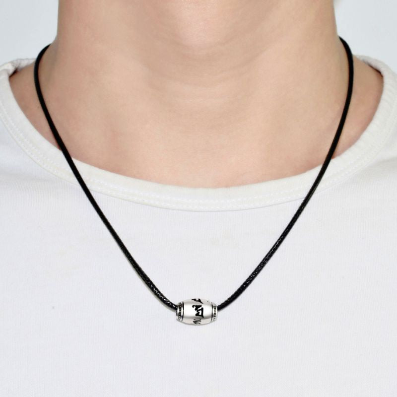 a man wear tibetan mantra sliver bead necklace 